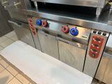 an image of a commercial kitchen with stainless steel appliances