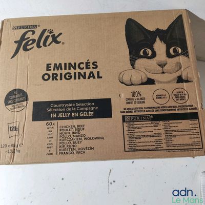 box of feli ' s original cat food sitting on top of a table