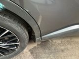 a close up of a car ' s tire with a hole in the side