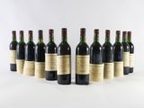 a group of six bottles of wine sitting next to each other