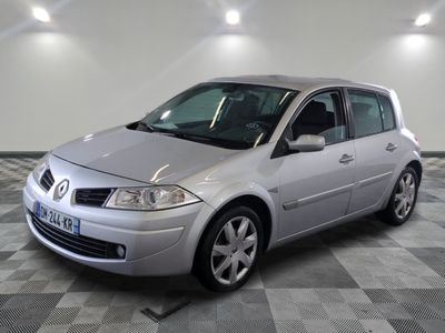 a picture of a silver car parked in a garage