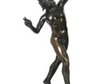 bronze statue of a man holding a tennis racquet on a marble base