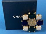 a close up of a box with a ring on top of it