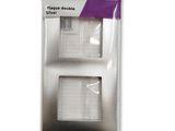 a pair of two pieces of white paper are in a package