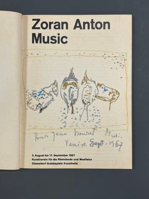an open book with a drawing of horses on it
