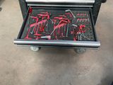 many tools in a tool box on the floor