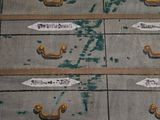 a lot of drawers with tags on them on the floor