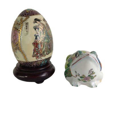 an egg and a pig figurine sitting next to each other
