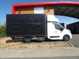 a white truck that is parked in front of a building
