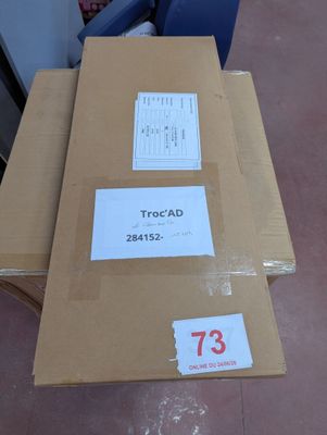 a box with a price tag on it sitting on the floor