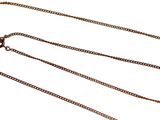 a necklace with a gold chain on it on a white background