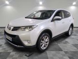 the white toyota rav is parked on a checkered floor