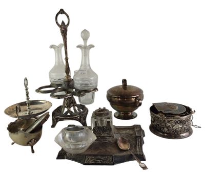 a lot of silver and glass items sitting on a table