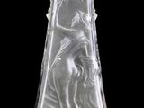 an etched glass decanter with a woman and a bird on it