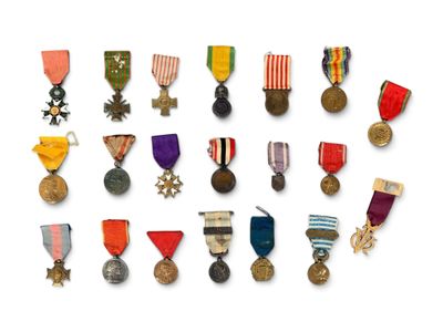 a lot of medals that are on a white surface