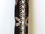 a black and white vase with a pattern on it