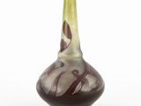 a glass vase with a brown and white design on it