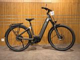 a bike that is parked in front of a wooden wall