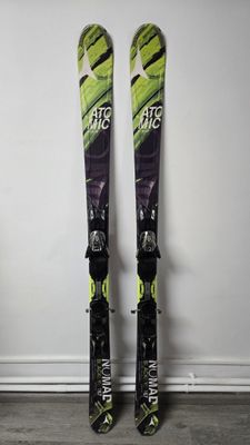pair of skis leaning up against a wall in a room