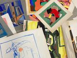 a lot of art work on display on the floor