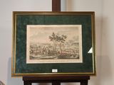 tableau représentant une vue de ville, dans un cadre vert posé sur un socle
