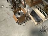a box that is sitting on the floor next to a stove