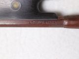 a knife that is sitting on top of a piece of wood