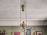 three lamps hanging from the ceiling in a room