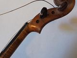 a violin that is sitting on top of a table
