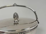 a silver box with a handle on it