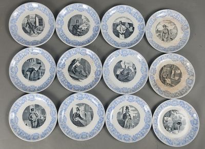 twelve blue and white plates with pictures of people on them