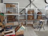 a room filled with boxes and a clock in the background