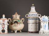 five different types of vases sitting on a table