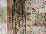a close up of a rug with a cat laying on it