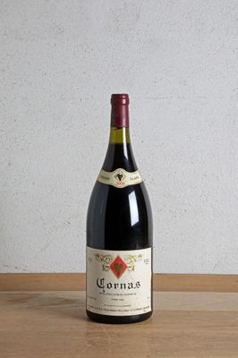 a bottle of wine sitting on a wooden table