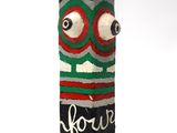 une canette de soda avec un visage dessiné dessus