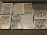 a lot of different stamps on the pages of a book
