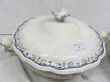 a white plate with a blue and yellow design on it
