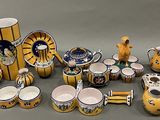 many different types of vases and bowls on the table