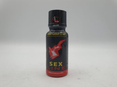 un gros plan d'un flacon de parfum « Sex Line » posé sur une surface blanche