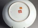 a white plate with a red and yellow design on it