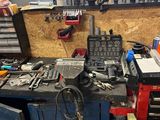 a workbench with tools on it in a workshop