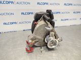 a picture of a car engine that is sitting on the floor