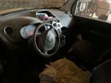 dashboard of a car with a bunch of items in the passenger seat