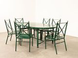 an image of a glass table and four chairs in a room