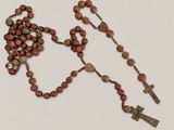 a close up of a rosary with a cross on it