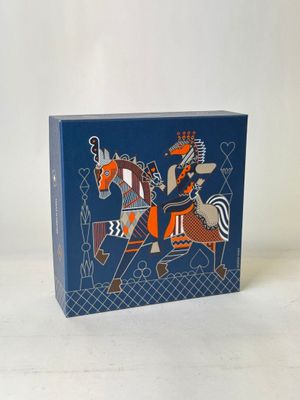 an image of a blue box with a picture of a man riding a horse