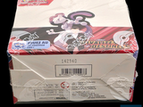 a box of pokemon trading cards on a black background