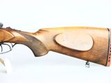 an old rifle with a wooden barrel and a wooden handle