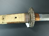 a close up of a knife that is on a table